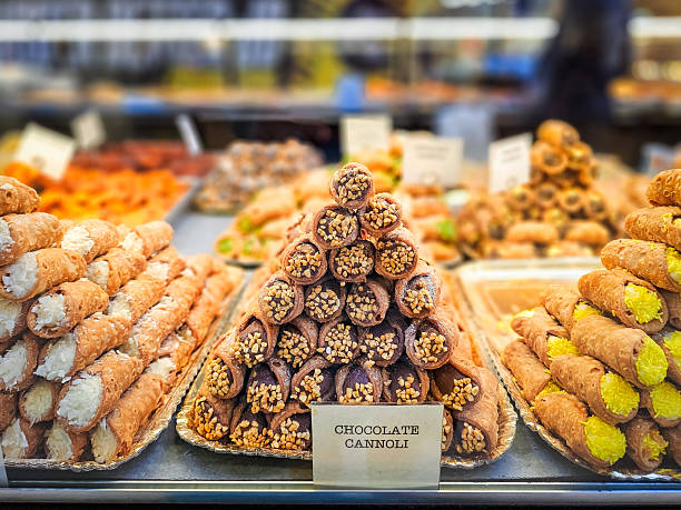 istock Close up of cannoli stacked in bakery window 2234451138