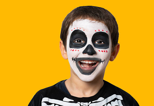 Little boy dressed up as a skeleton for Halloween