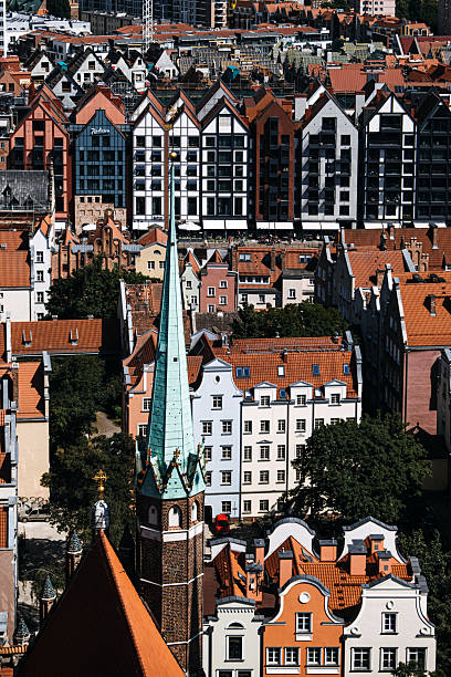 istock Modern and historic architecture blending in Gdansk skyline with red rooftops and spires. Vibrant urban landscape. Gdansk, Poland - May 19, 2024 2234453415