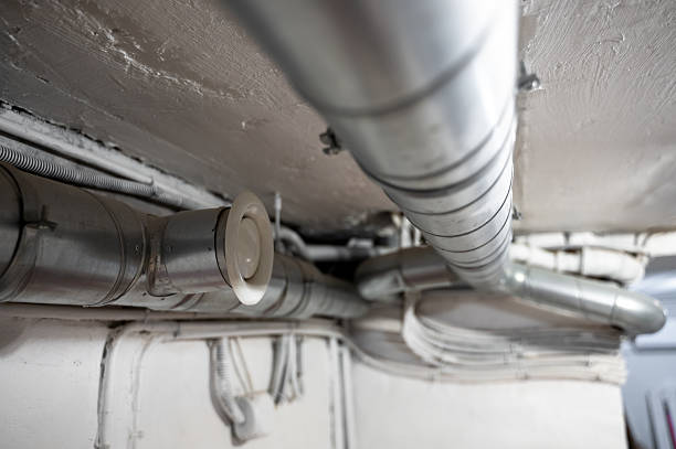 istock Ventilation pipes installed along ceiling in house basement 2234461489