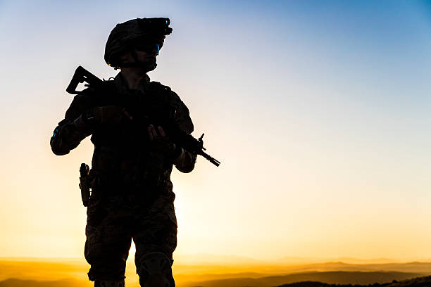 istock Soldier walking in battlefield at sunset 2234462016