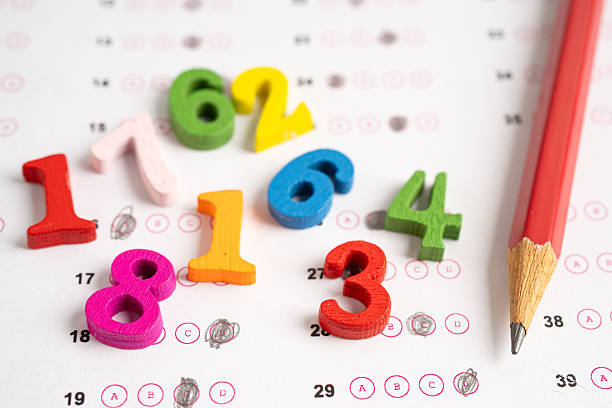 istock Math Number colorful and pencil on answer sheet paper. 2234466280