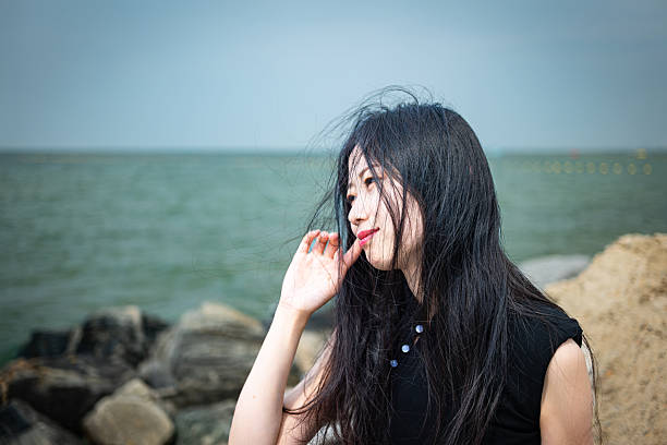 Back view of woman sitting in pose relaxing