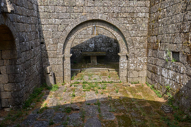 istock Interior of medieval ruins with a stone arch and altar 2234467679