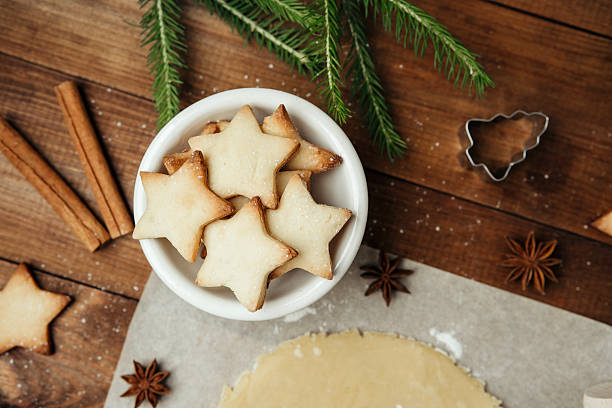 istock Festive cookie dough and baking setup on wooden table for christmas culinary and rustic food concept 2234468040