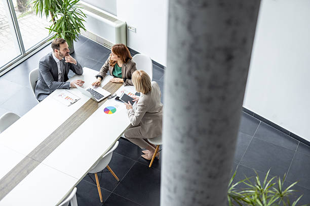 istock Businesspeople having meeting using laptop and digital tablet in modern office 2234472212