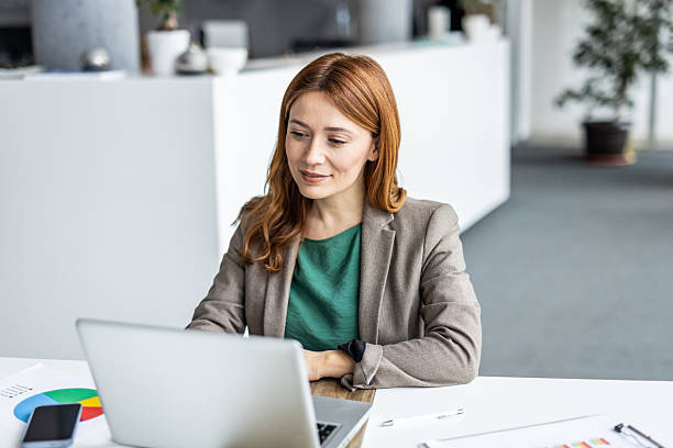 istock Businesswoman working on laptop in modern office 2234472939