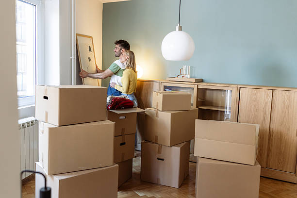istock Couple arranging artwork during moving into a new apartment 2234473981