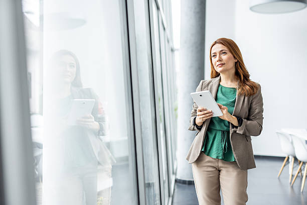 istock Businesswoman using digital tablet in modern office 2234477606