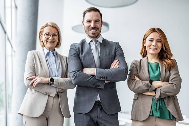 istock Smiling business team posing with confidence in modern office 2234477792