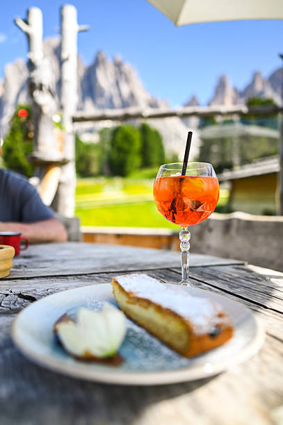 istock Spritz and apple strudel with dolomites view in italian alps 2234477803