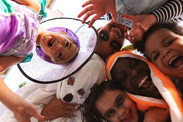 istock Children wearing Halloween costumes making funny faces 2234477879