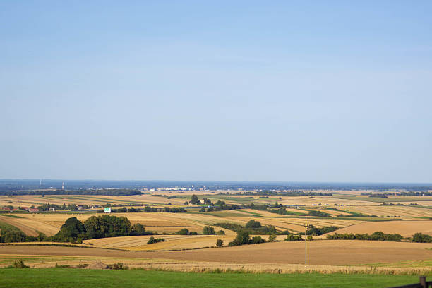 istock Expansive rural landscape with fields and distant horizon under clear sky 2234479610