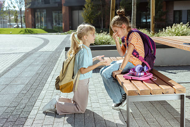 istock A little girl comforts her crying friend 2234481588