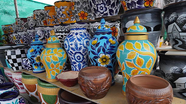 istock Shelves filled with painted ceramic pots with floral patterns 2234482162