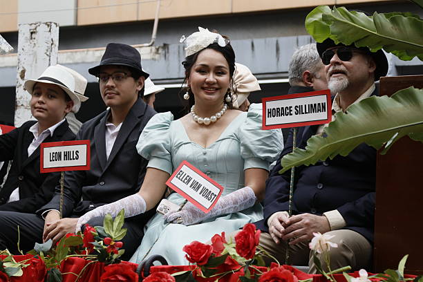 Lisbon, Portugal - June 12, 2025: Men and women dressed in traditional folklore costumes parade in Lisbon downtown during this city celebrations of the Popular Saints.