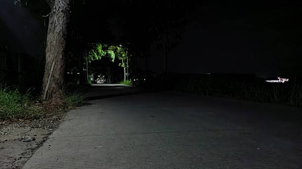 istock rural road view at night 2234486618
