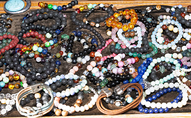istock Assorted handmade bead bracelets with natural stones and lava beads close up. 2234487630