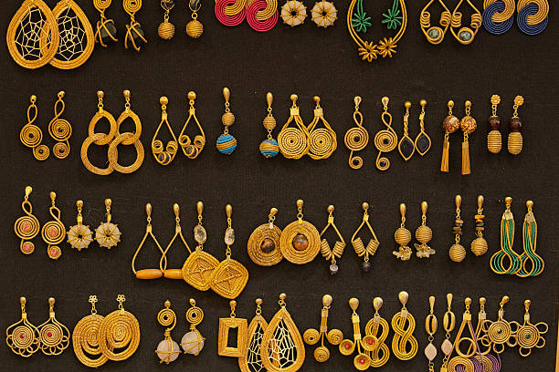 This jewelry display in a Mardin market features gold earrings and necklaces presented on red velvet stands. These elegant pieces are part of bridal dowries and reflect both regional craftsmanship and cultural heritage in southeastern Anatolia.