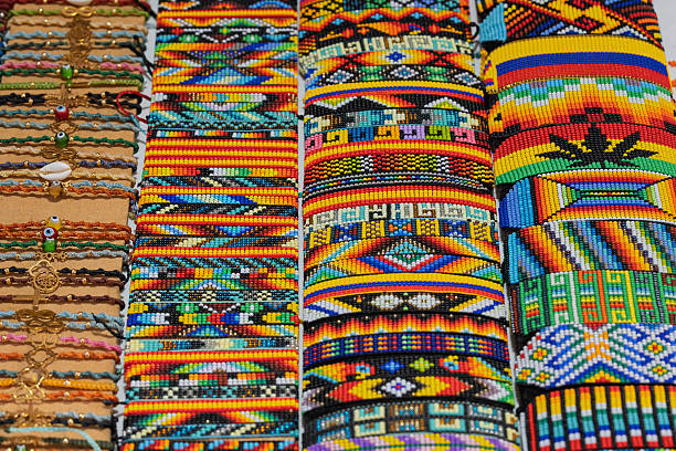 istock Colorful handmade bracelets with beads and thread on market display. 2234488626