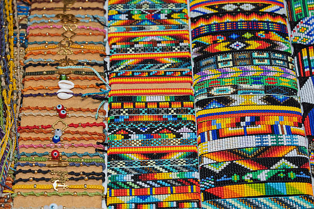 istock Colorful handmade bracelets with beads and thread on market display. 2234488627