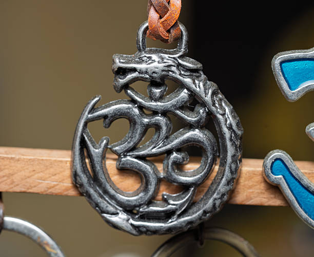 istock Handmade pendant with Om symbol and dragon design. 2234488704