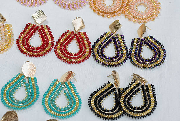 istock Handmade beaded teardrop earrings with gold details 2234488727