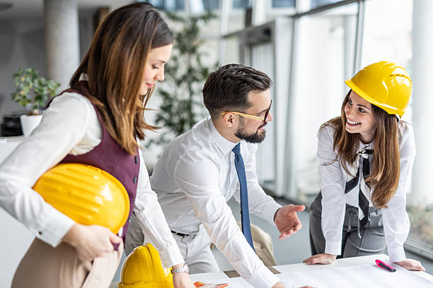istock Architects discussing blueprint in modern office: teamwork and collaboration 2234488798