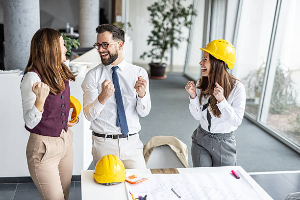istock Architects celebrating successful project in the office 2234488829