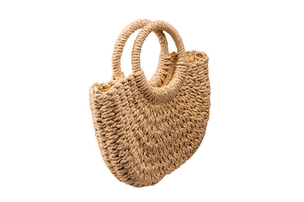 istock A beige straw bag isolated on a white background. 2234488866