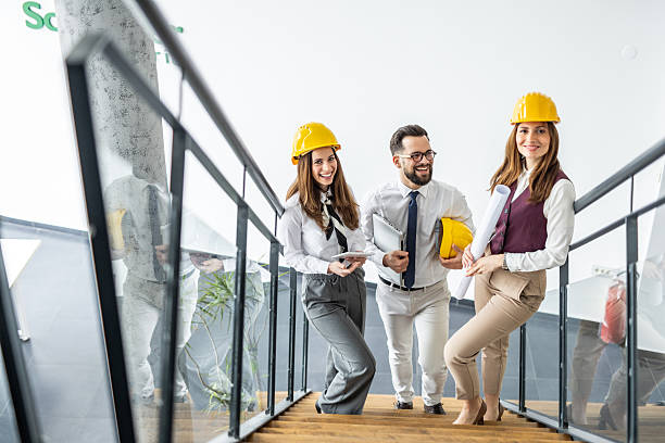 istock Architects walking down the stairs in modern office building 2234491304