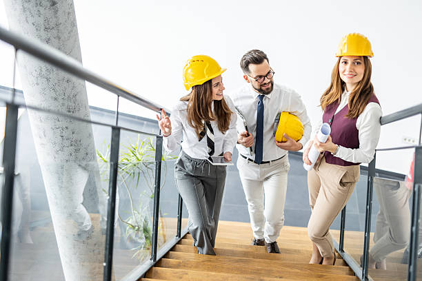 istock Architects walking down the stairs in modern office building 2234491310