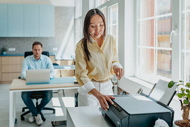 istock Collaboration and productivity thrive in a modern office space with professionals engaged in their tasks 2234491505