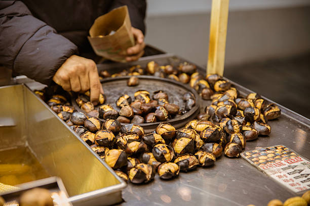 istock A vendor on the street roasts chestnuts 2234492015
