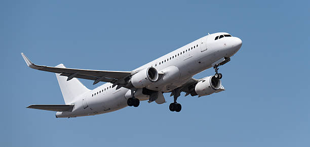 istock Airplane take off on the blue sky, Aircraft flying on sky background 2234493139