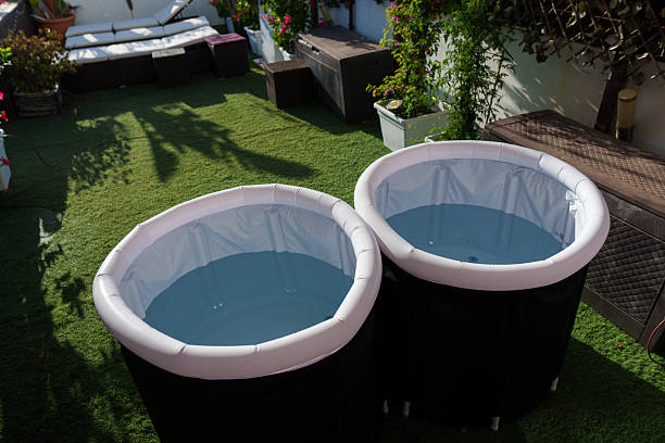 istock Two inflatable ice baths prepared for breathwork session in garden 2234494528