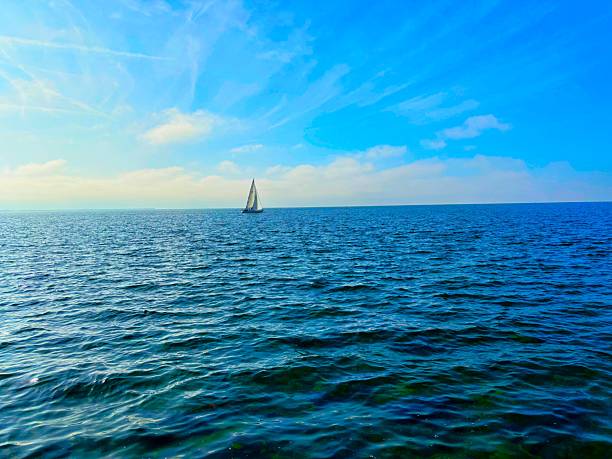 A lonely sailing boat at sea