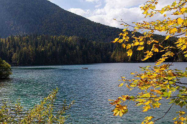 istock Small boat on an autumn lake 2234495699