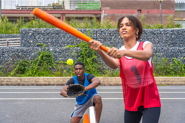 A softball player preparing to bunt.