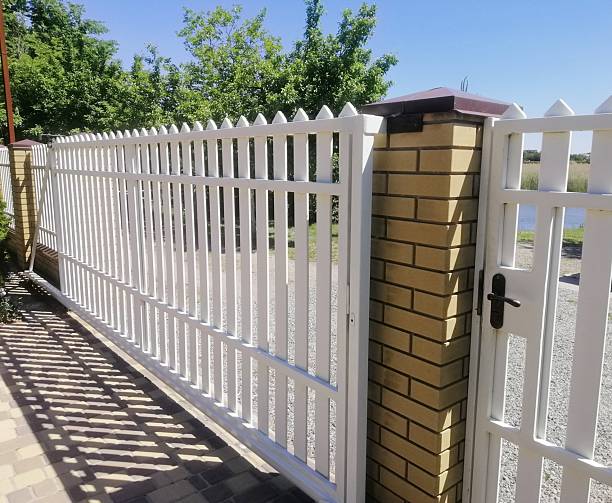 istock White modern fence defines private property with clean geometric lines. 2234501914
