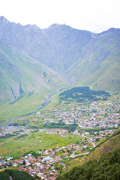 istock Mountain Valley Town Surrounded by Rocky Peaks 2234502640