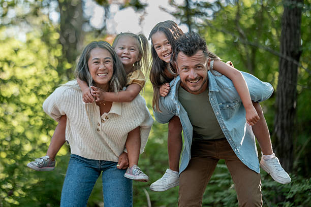 istock Happy Family Enjoying Time Together Outdoors in a Forest Setting 2234502973