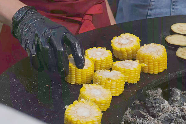 Corn on the cob over iron grill