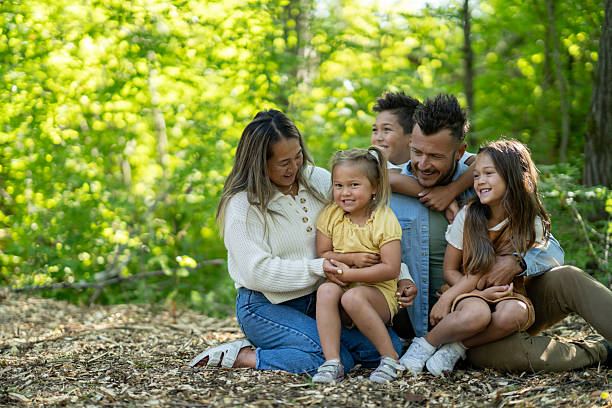 istock Happy Family Sharing a Fun Moment Outdoors in the Forest 2234503846