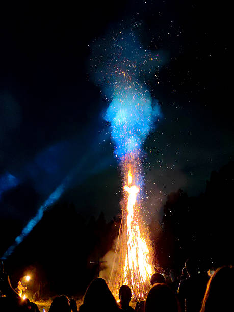 istock Burning bonfire at night with people 2234504612