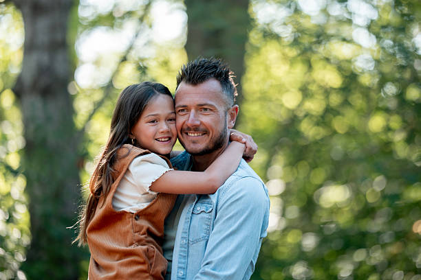 istock Father and Daughter Bonding Outdoors in a Natural Forest Environment 2234505987