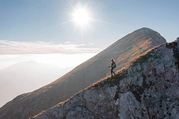 istock Hiking along a mountain ridge at sunrise 2234506359