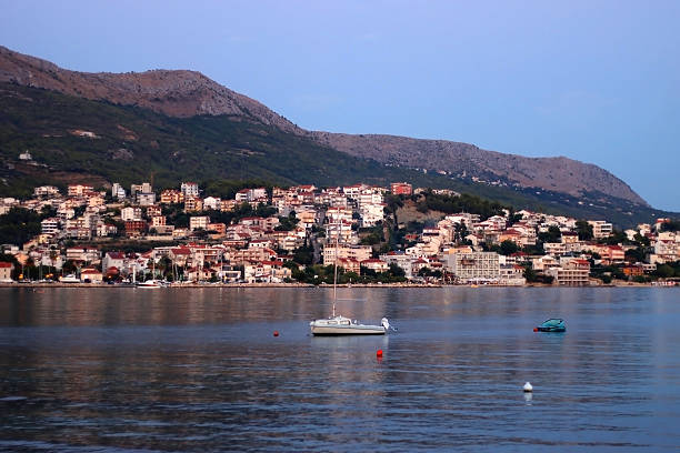 Podstrana, Croatia - August 23, 2022: Sailing boat on the Adriatic sea. View of Podstrana, small coastal town in Croatia.