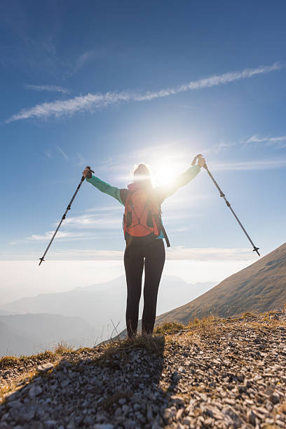 istock Sunlit hiker at the summit 2234507061