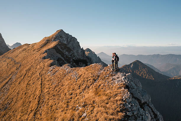 istock Hikers enjoying view from mountain peak 2234507654